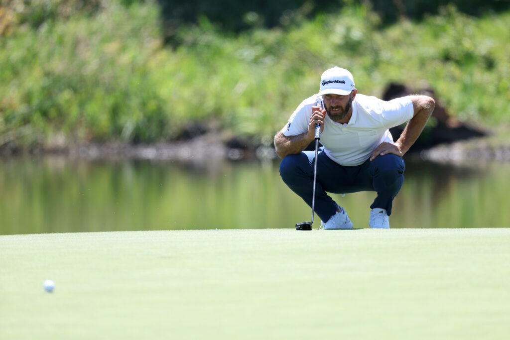 Dustin Johnson lines up a putt at the LIV Golf Portland event in June 2022. 